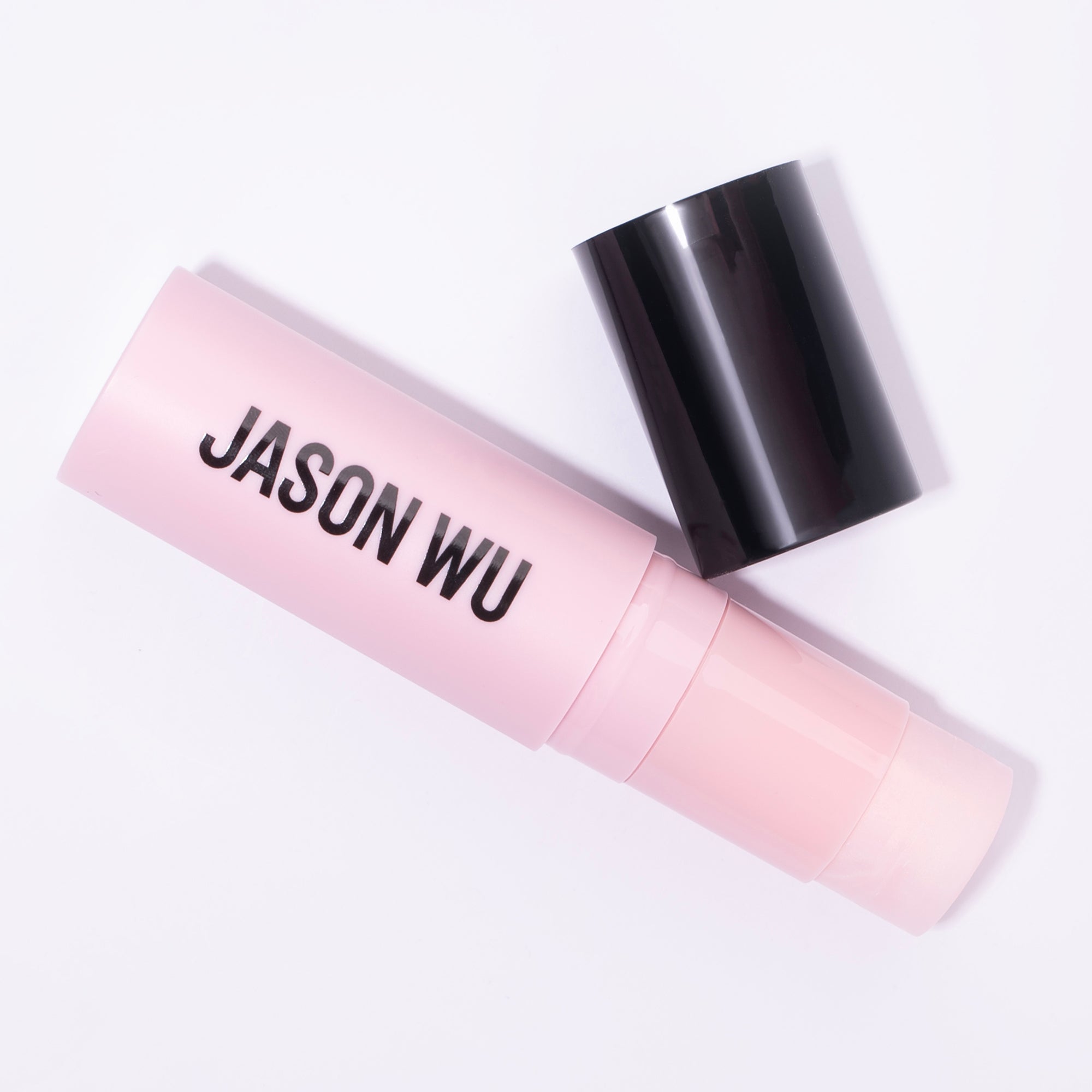 Pink lipstick tube labeled 'Jason Wu' with black cap.