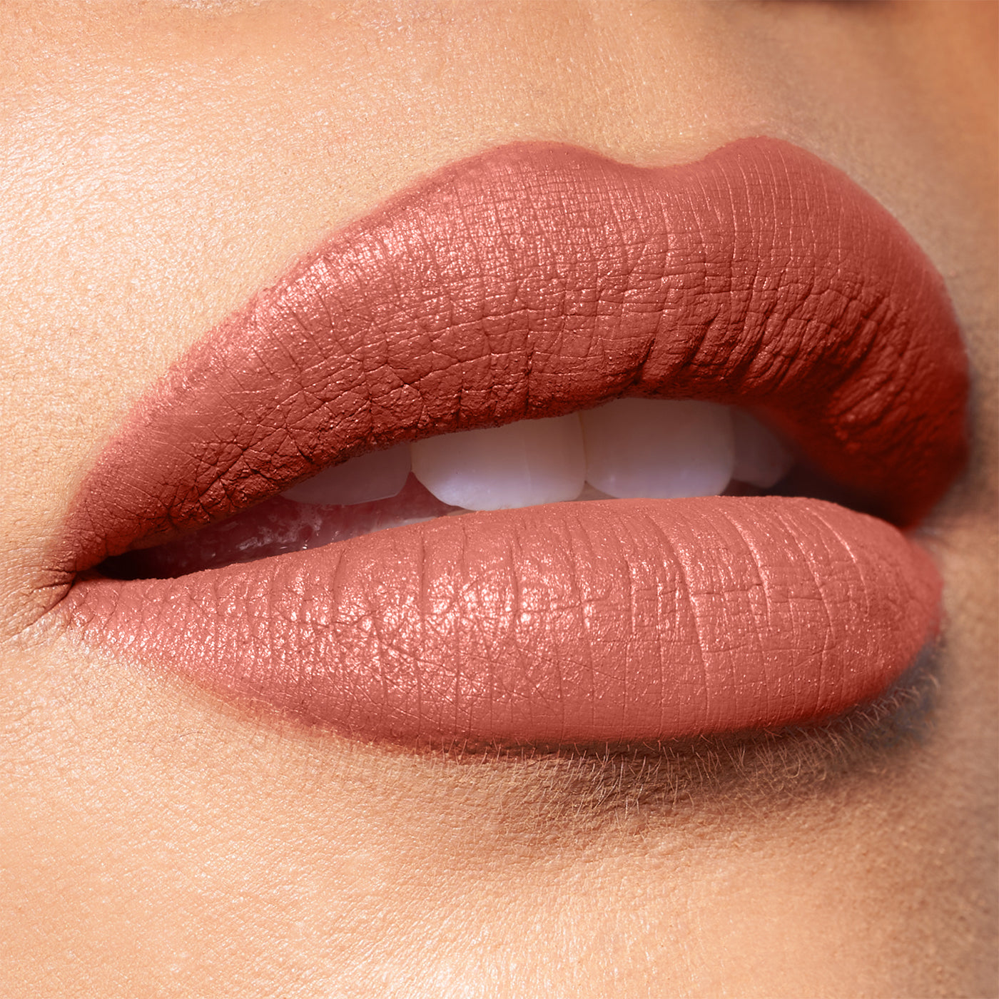 Close-up of lips wearing matte nude lipstick