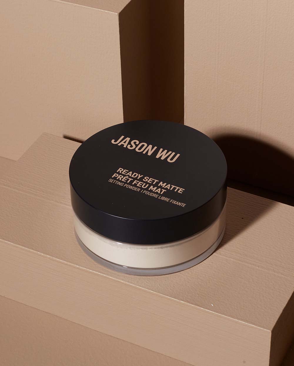 Jason Wu Ready Set Matte face powder on beige background