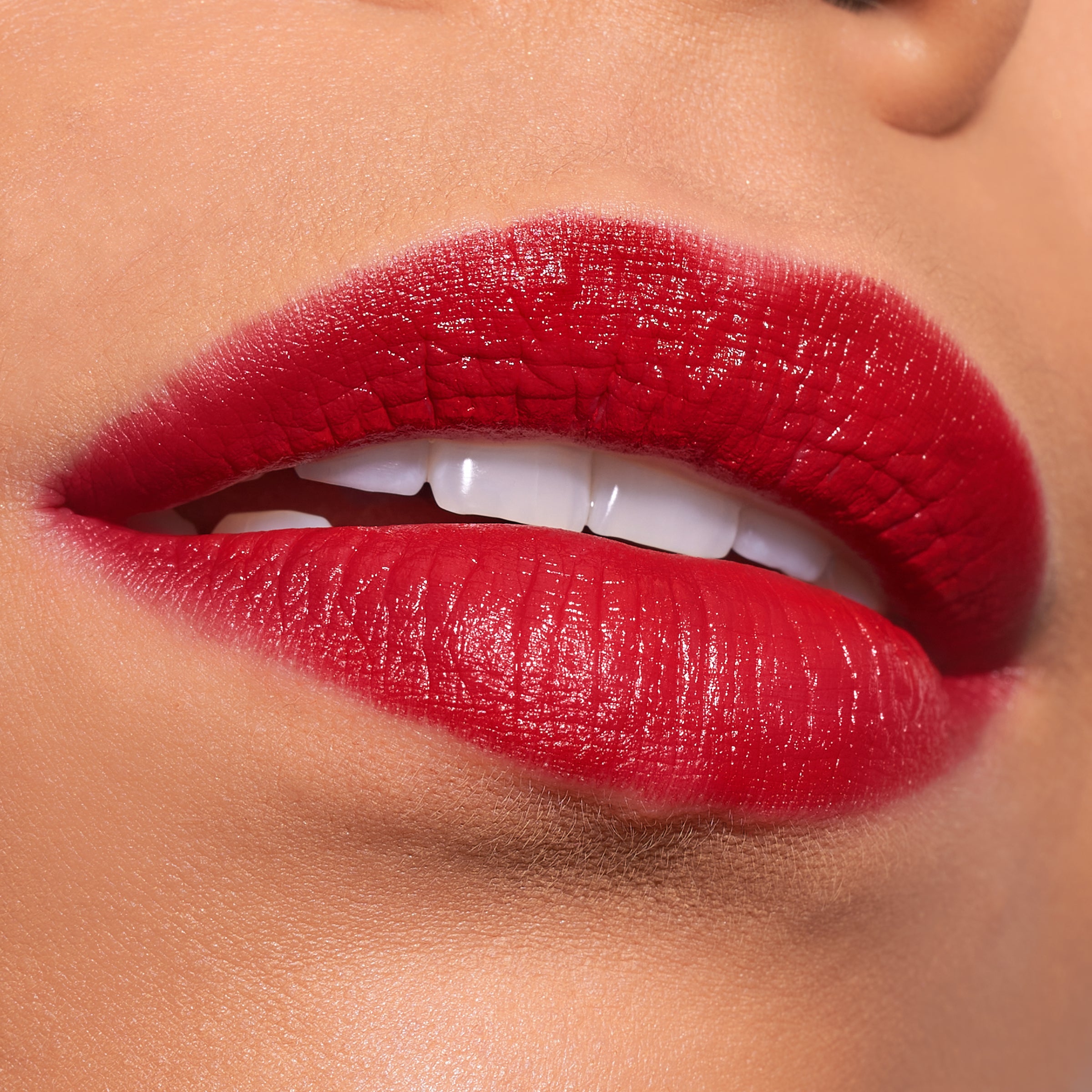 Close-up of a person wearing vibrant red lipstick