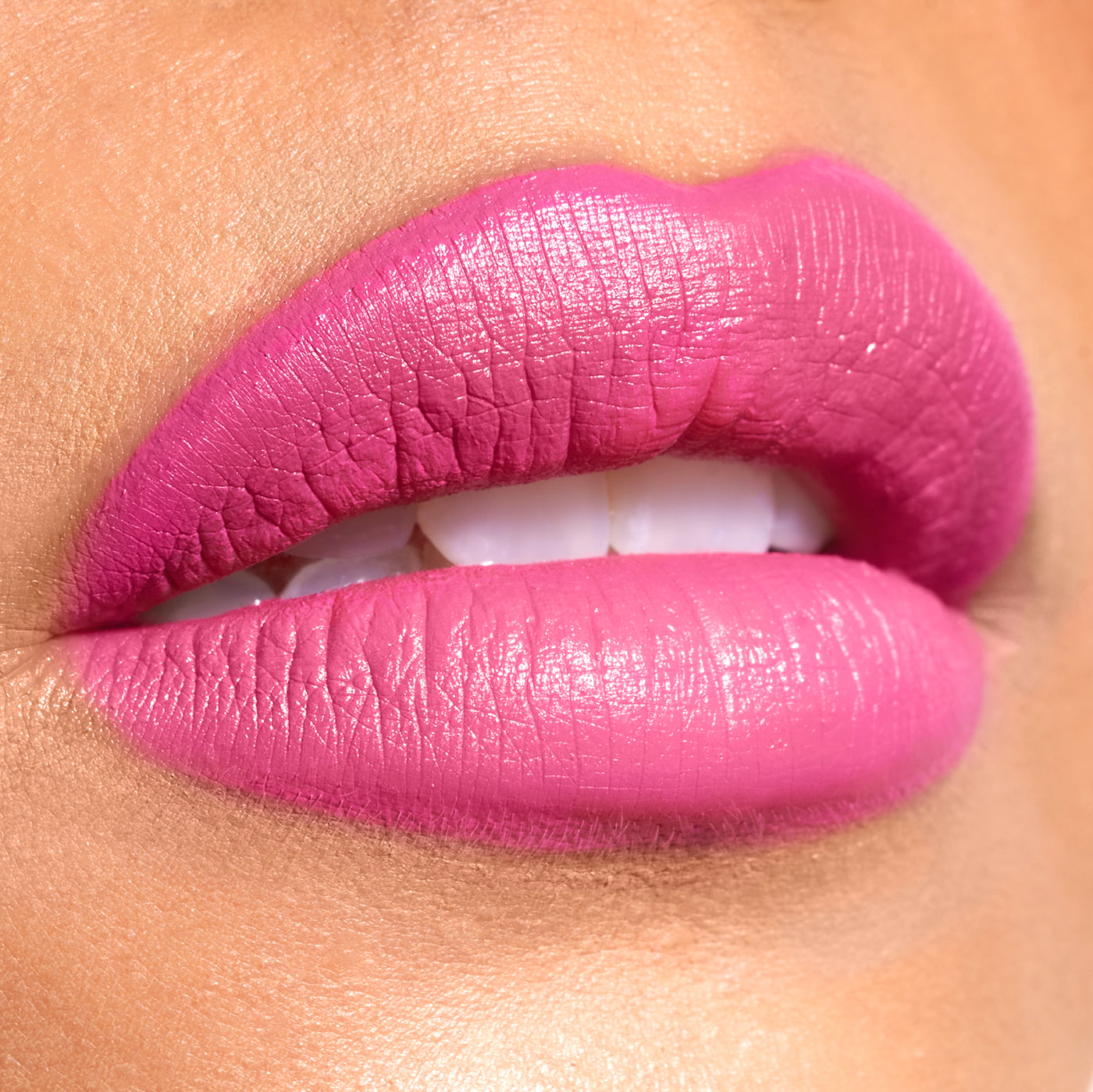 Close-up of lips with bright pink lipstick