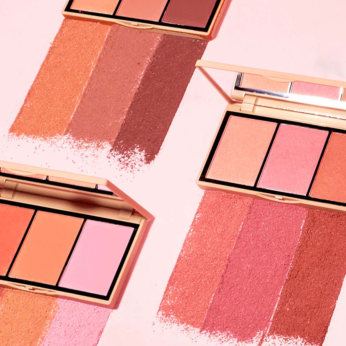 Three makeup palettes with various shades of blush on a light pink background